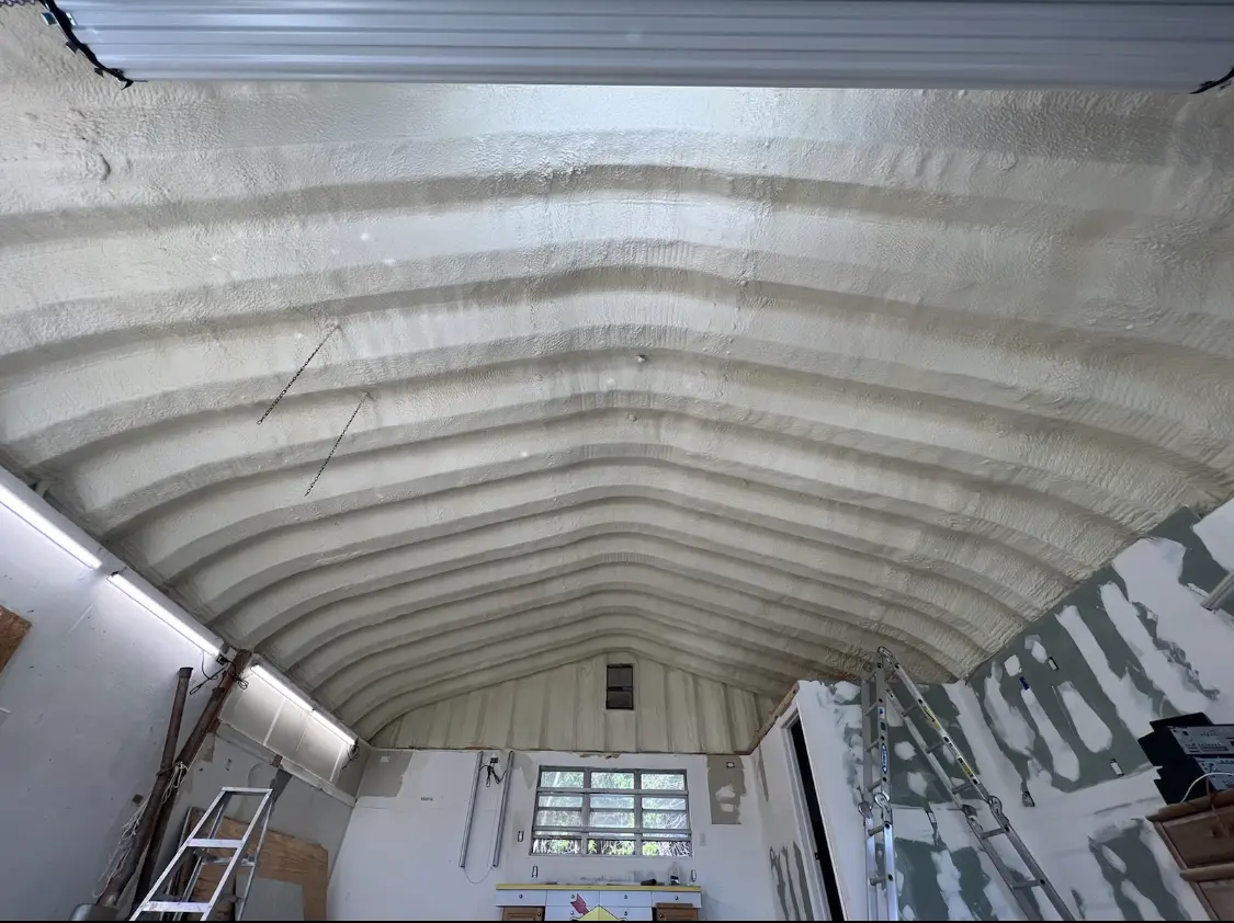 Spray polyurethane foam applied to the underside of a metal roof deck in Guadalupe
